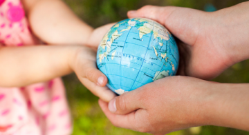 hands holding globe